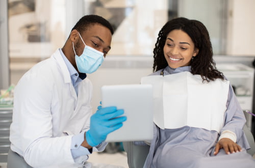 Dentist discussing treatment options and CDCP coverage with a patient at a Mississauga dental clinic.
