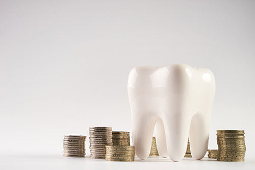Dental tooth model and calculator representing insurance coverage, financing, and payment options for dental bridge treatment.