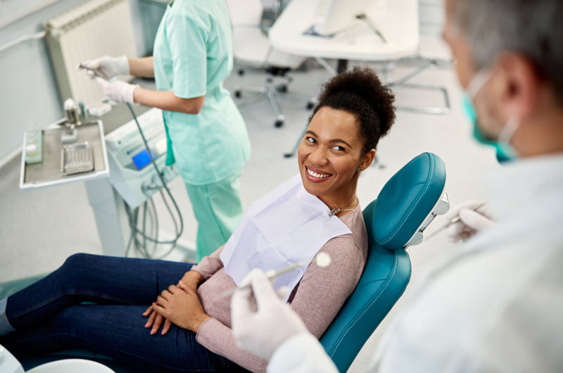 Patient discussing dental check-up and cleaning with a dentist in Mississauga