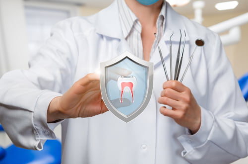 A dentist providing emergency dental treatment to relieve severe tooth pain or infection.