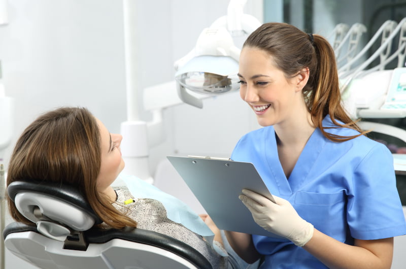 Dentist discussing a patient's dental history during a check-up in Mississauga