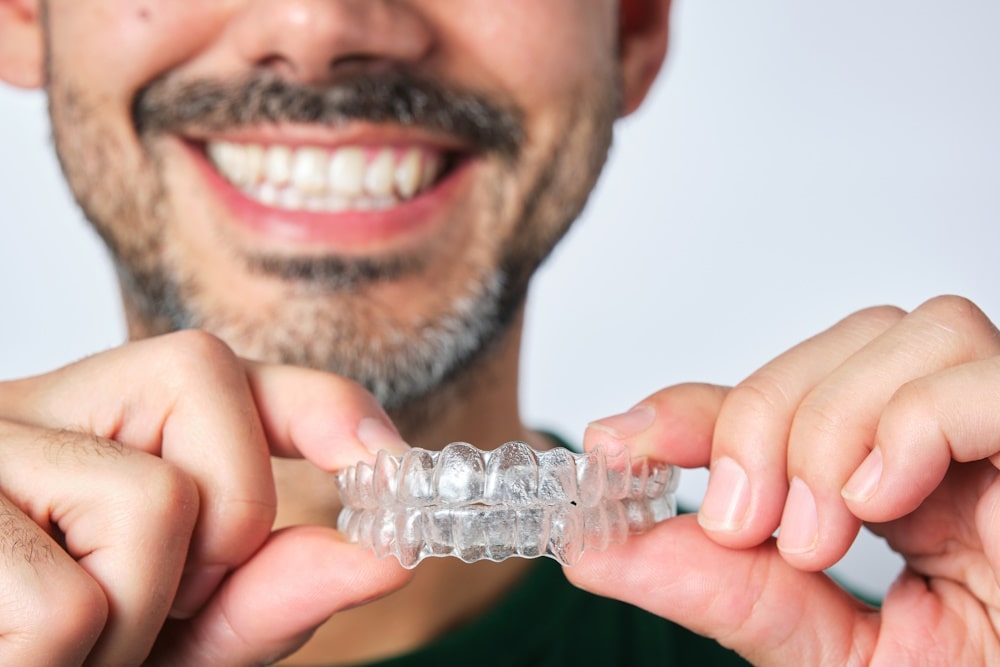 Man holding invisalign