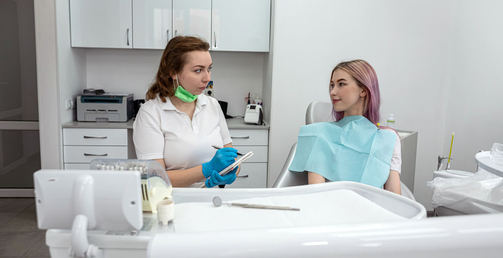 Patient receiving dental treatment for recurring tooth pain in clinic