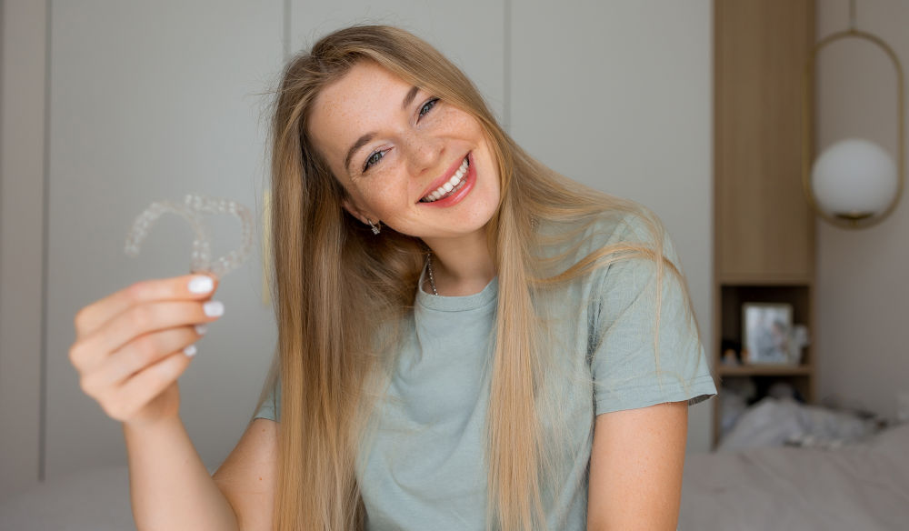 Smiling Patient After Invisalign Treatment and Dental Care Close-up portrait of a smiling patient representing confident results after Invisalign or cosmetic dental treatment